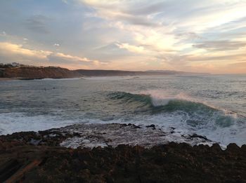 Scenic view of sea against dramatic sky