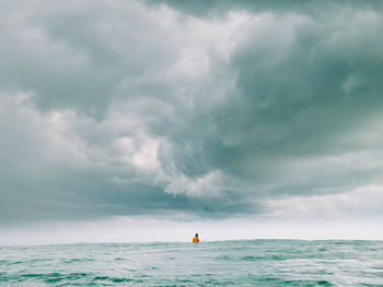 Surfer in the middle of a storm