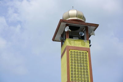 Low angle view of clock tower against sky