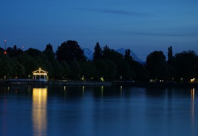 Scenic view of lake against sky at dusk