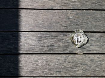 High angle view of wooden plank on table
