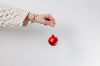 Close-up of christmas decorations against white background