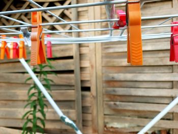 Red metal railing hanging on staircase against building