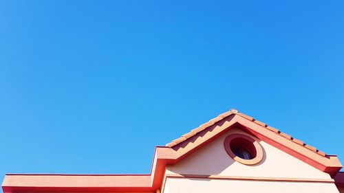 Low angle view of building against blue sky