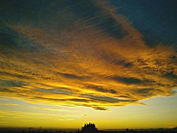 Scenic view of dramatic sky during sunset