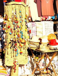 Clothes hanging in store for sale at market stall