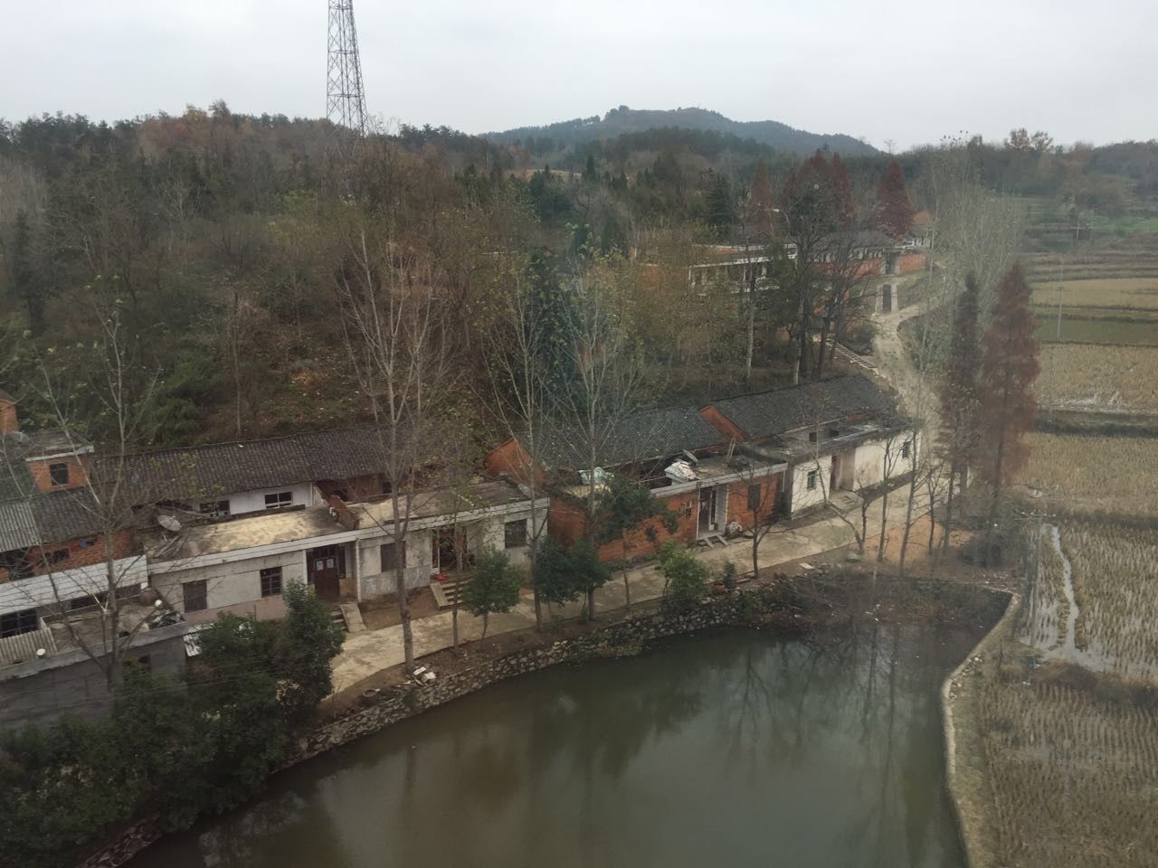 built structure, water, architecture, tree, connection, mountain, river, building exterior, waterfront, bridge - man made structure, reflection, nature, sky, house, tranquility, tranquil scene, electricity pylon, day, high angle view, scenics