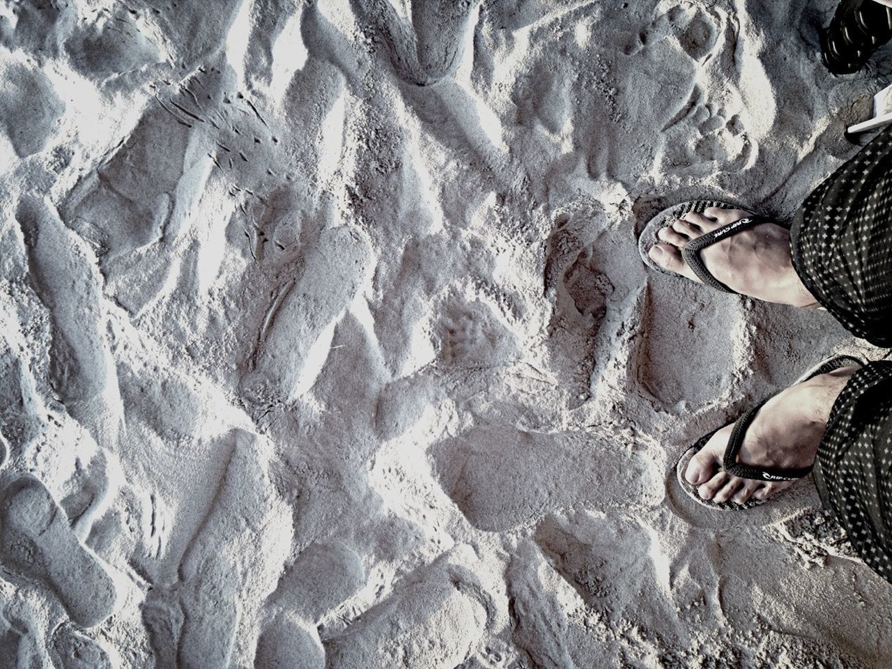 high angle view, low section, shoe, person, pattern, footwear, sunlight, outdoors, day, close-up, part of, human foot, rock - object, personal perspective, textured, stone - object