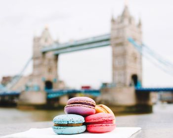 Colorful macaroons against tower bridge