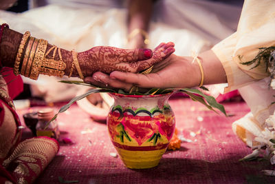 Close-up of hands on table