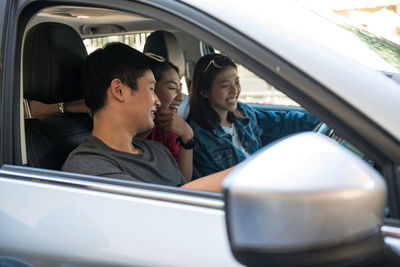 Side view of woman in car