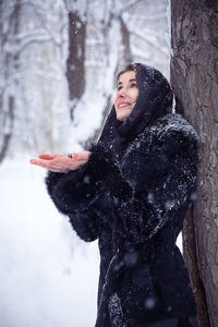 Young woman in snow during winter