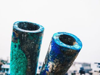 Close-up of multi colored pencils against clear blue sky