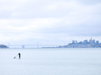 Side view of man in city during winter