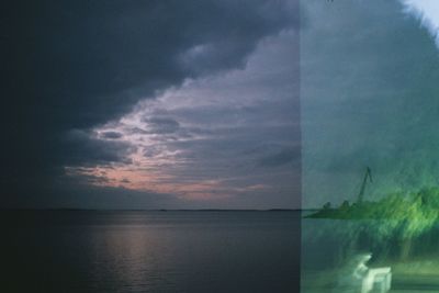 Scenic view of sea against sky at sunset