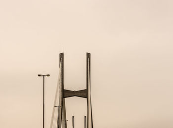 Low angle view of silhouette sculpture against clear sky