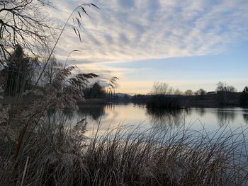 Scenic view of lake against sky during sunset