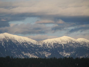 Scenic view of mountains against sky during winter