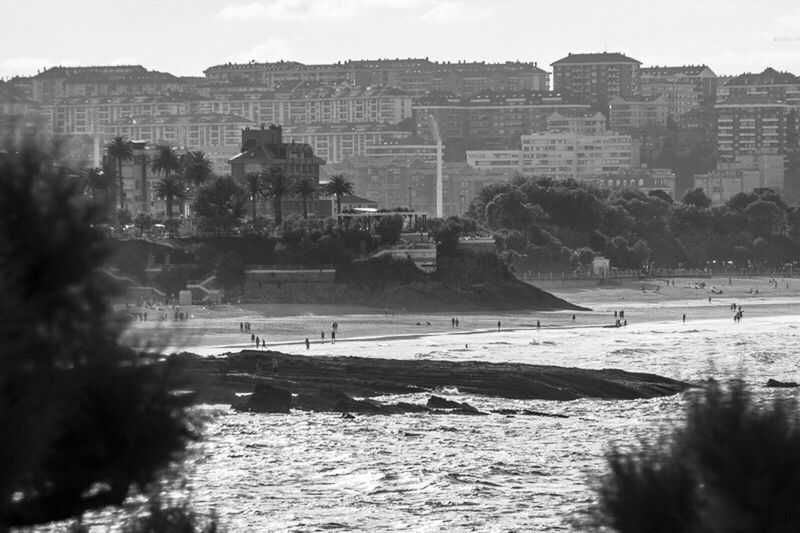 VIEW OF RIVER WITH BUILDINGS IN BACKGROUND