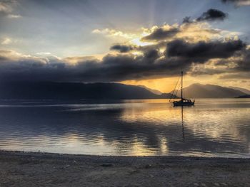 Scenic view of sea against cloudy sky