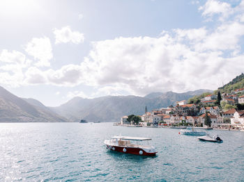 Boats in sea against sky
