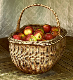 Close-up of apples in wicker basket