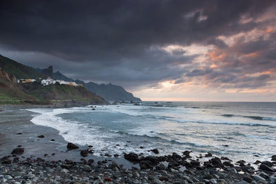 Scenic view of sea against cloudy sky