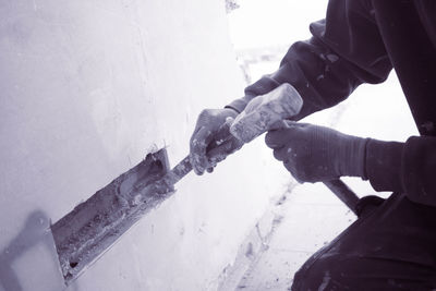 Midsection of worker working in construction site