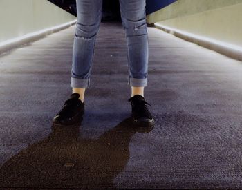 Low section of man standing on ground