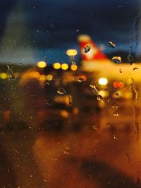 Close-up of window against sky at night