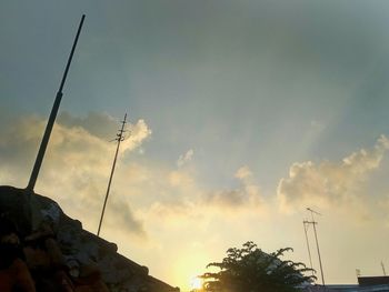 Low angle view of silhouette building against sky during sunset