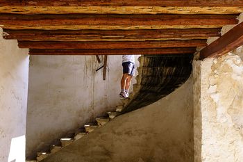 Low section of man standing on steps of building