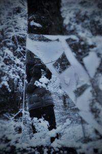 Snow covered sculpture against trees