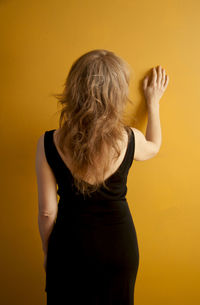 Beautiful woman standing in the dark