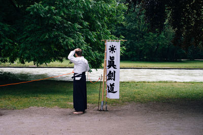 Full length of woman standing on grass