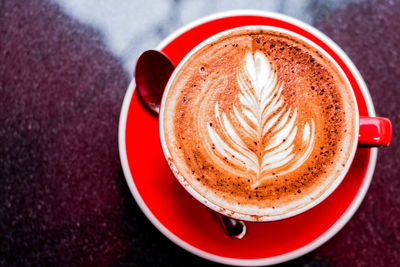 High angle view of cappuccino on table