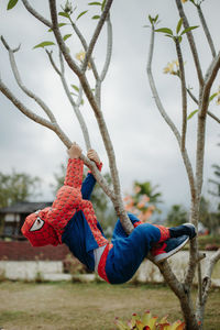 Low section of child on rope during winter