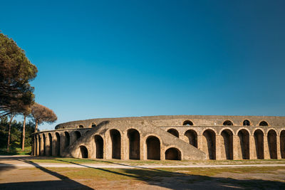 Ruins of building against blue sky