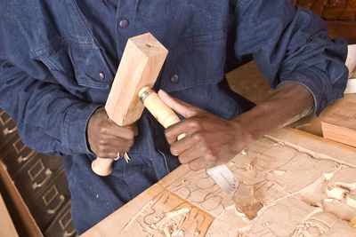 Midsection of man working at home