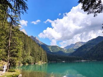 Scenic view of lake and mountains against sky