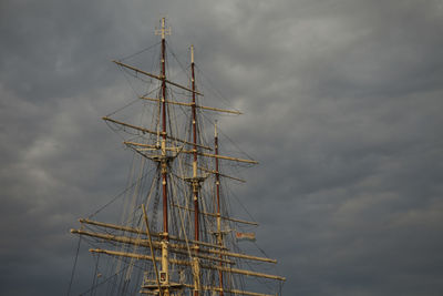 Low angle view of sailboat in sea against sky