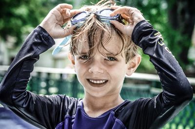 Portrait of cute boy wearing swimming goggles