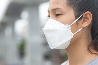 Woman wearing a mask to prevent dust and bacteria