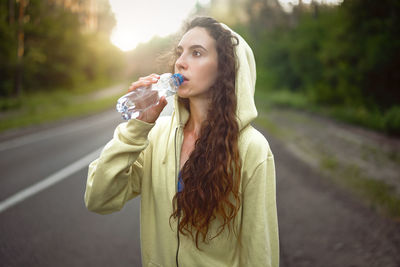 Portrait of young woman holding ice cream