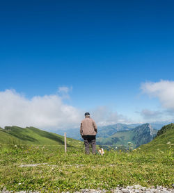 Rear view of man looking at mountains