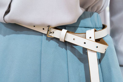 Close-up midsection of woman wearing belt