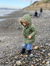 Portrait of boy standing at beach