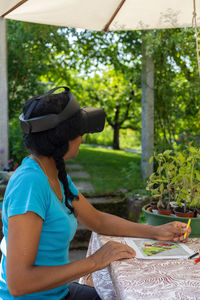 Side view of man working at park