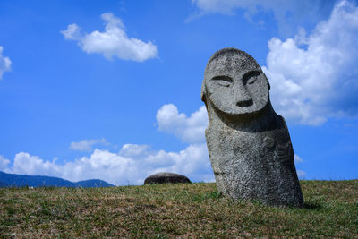 Low angle view of statue against sky