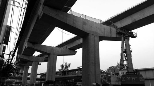 Low angle view of elevated road against sky